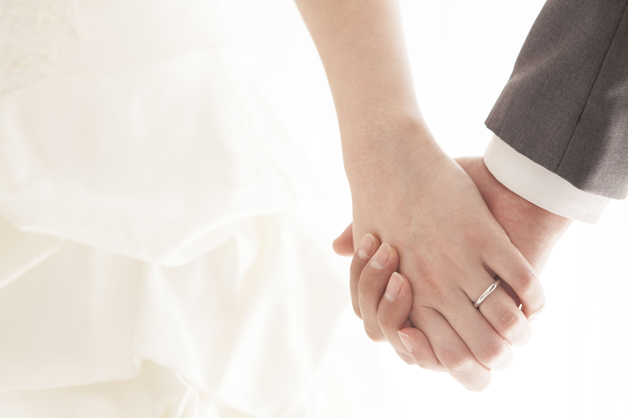 Holding hands wedding rings
